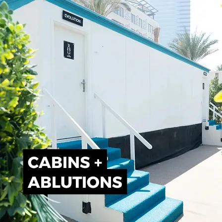 Temporary event site cabin with steps and external access for welfare and ablution facilities.