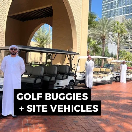 Golf buggies lined up at an outdoor event site for personnel and operational transport.