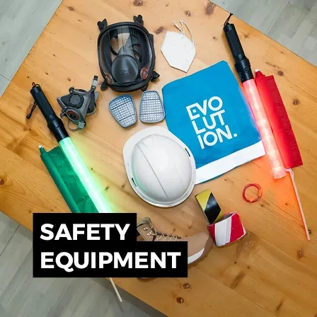 Personal protective equipment and fire safety items arranged on a table for event site operations.
